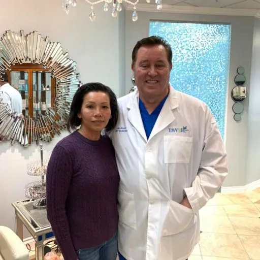 A client in a purple sweater with James Hooper