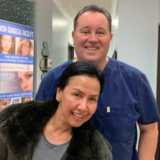 A selfie of James Hooper with a smiling client