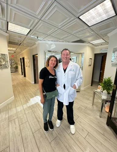 James Hooper with a client in the studio corridor