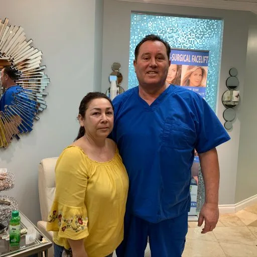 A client in a yellow top with James Hooper