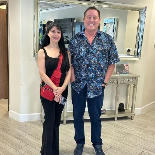 A client with James Hooper by the studio display cabinet