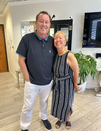A client with James Hooper by the studio mirror
