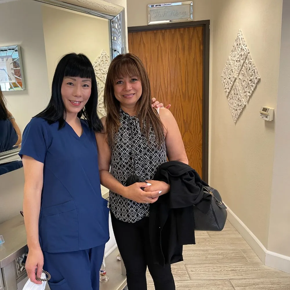 A team member with a client at the studio