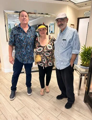 James Hooper with a visiting couple at the studio