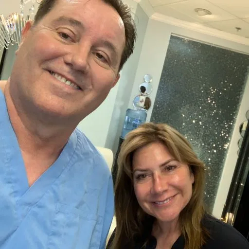A selfie of James Hooper with a smiling client