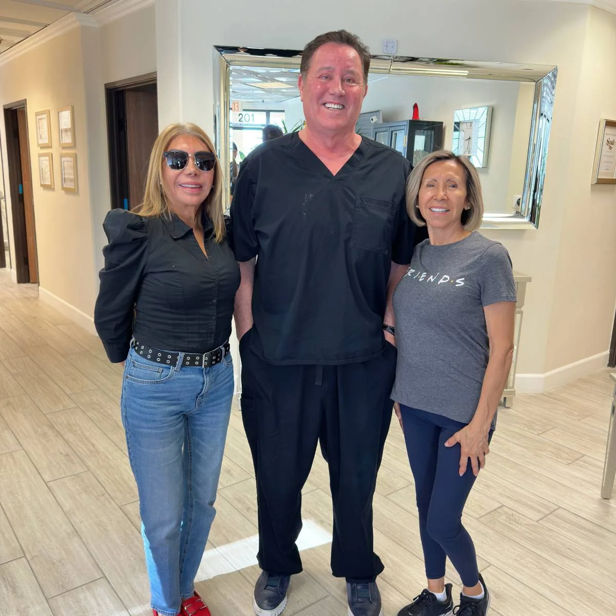 James Hooper with two clients at the studio