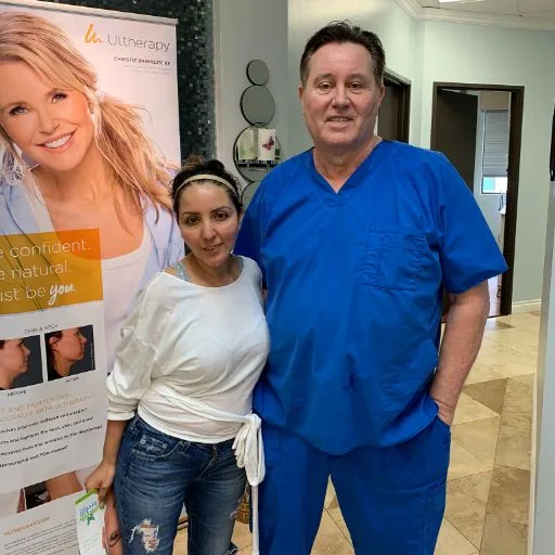 A young client with James Hooper by the treatment banner