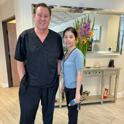 James Hooper with a team member by the studio flowers