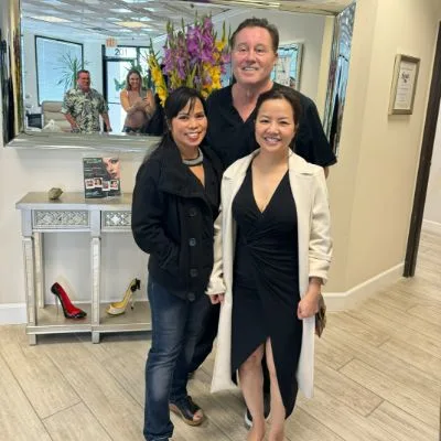 James Hooper with two clients at the studio