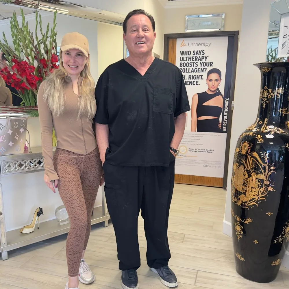 A client in a cap and activewear with James Hooper