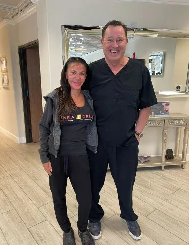 A client in black activewear with James Hooper
