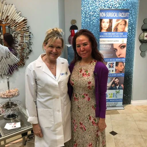 A practitioner with a client in a floral dress