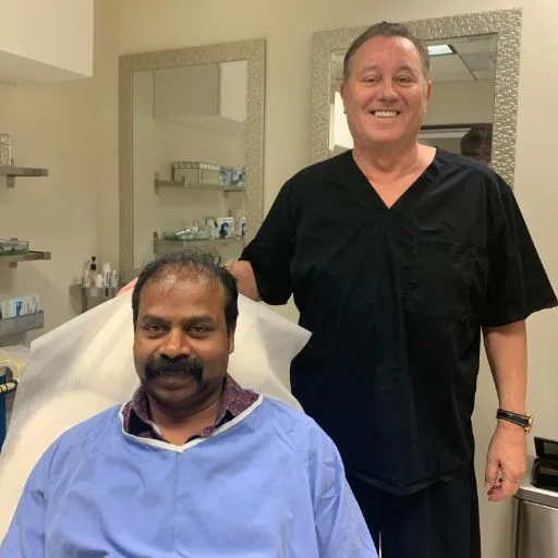 A client in the treatment chair with James Hooper