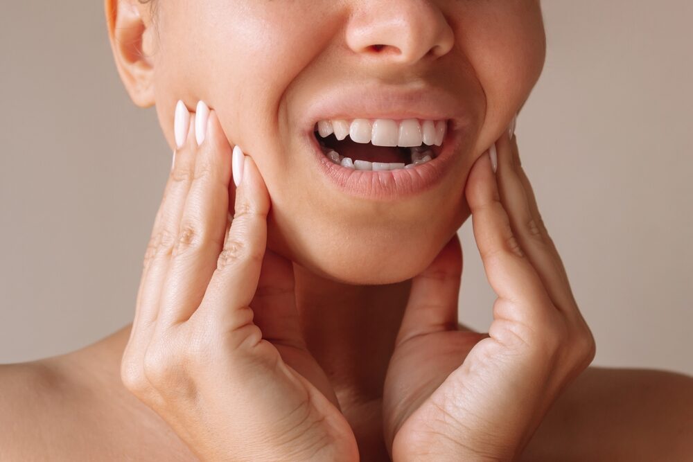Cropped,Shot,Of,A,Young,Woman,Suffering,From,Jaw,Pain
