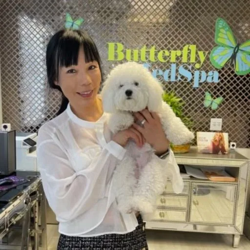 Lulu being held in front of the studio reception sign