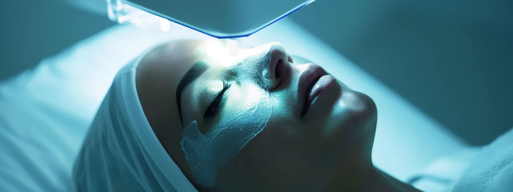 a gentle beam of light from a laser device focuses on a patient's skin, readying for a tightening treatment.