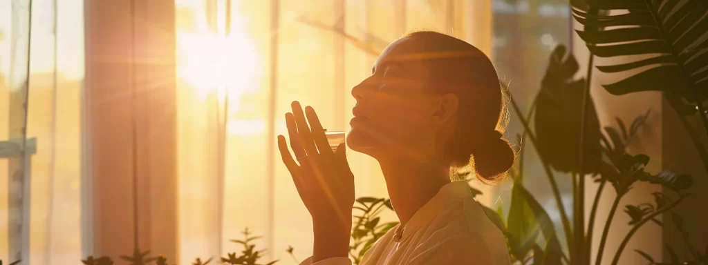 a serene, sunlit room with a person gently applying moisturizer to their glowing, rejuvenated skin after laser skin tightening treatment.